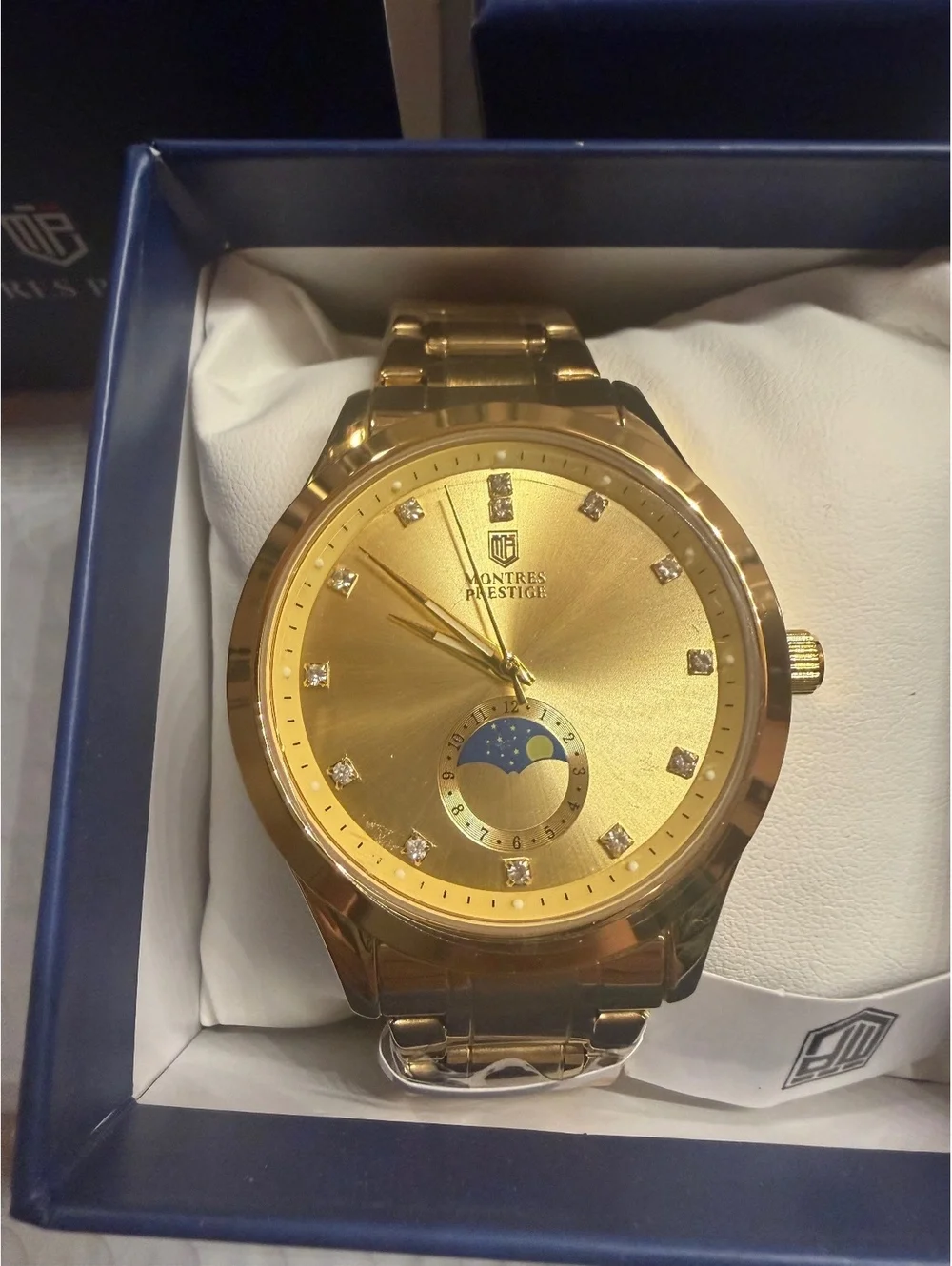 Montres Prestige gold-tone watch with moonphase dial